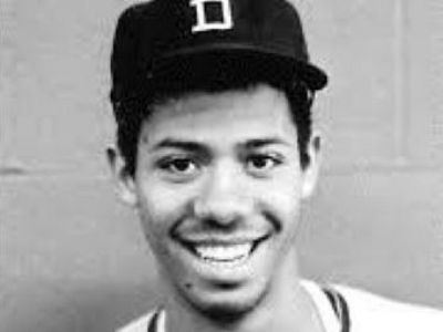 Harrison Wilson, III is wearing a cap that has a letter D on it.